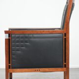 Art Deco design armchair with black leather with decorative stitching