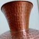Dented copper vase or jug