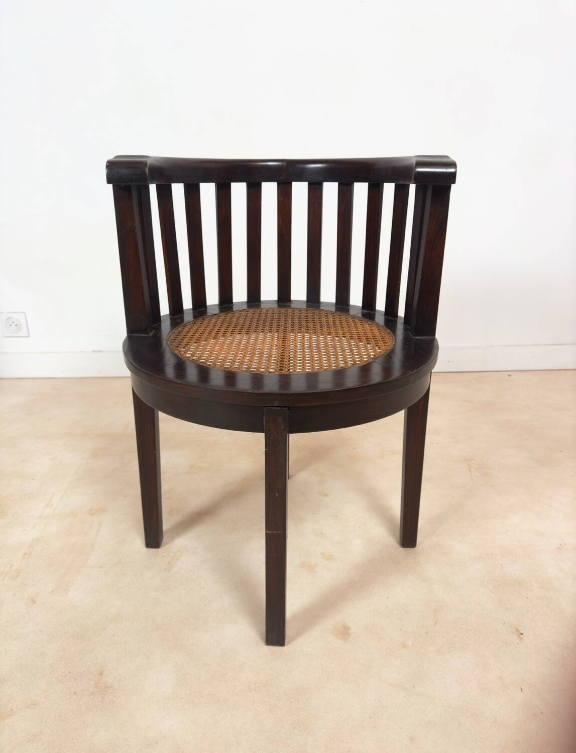 Colonial "Art Deco" armchair in wood and cane.