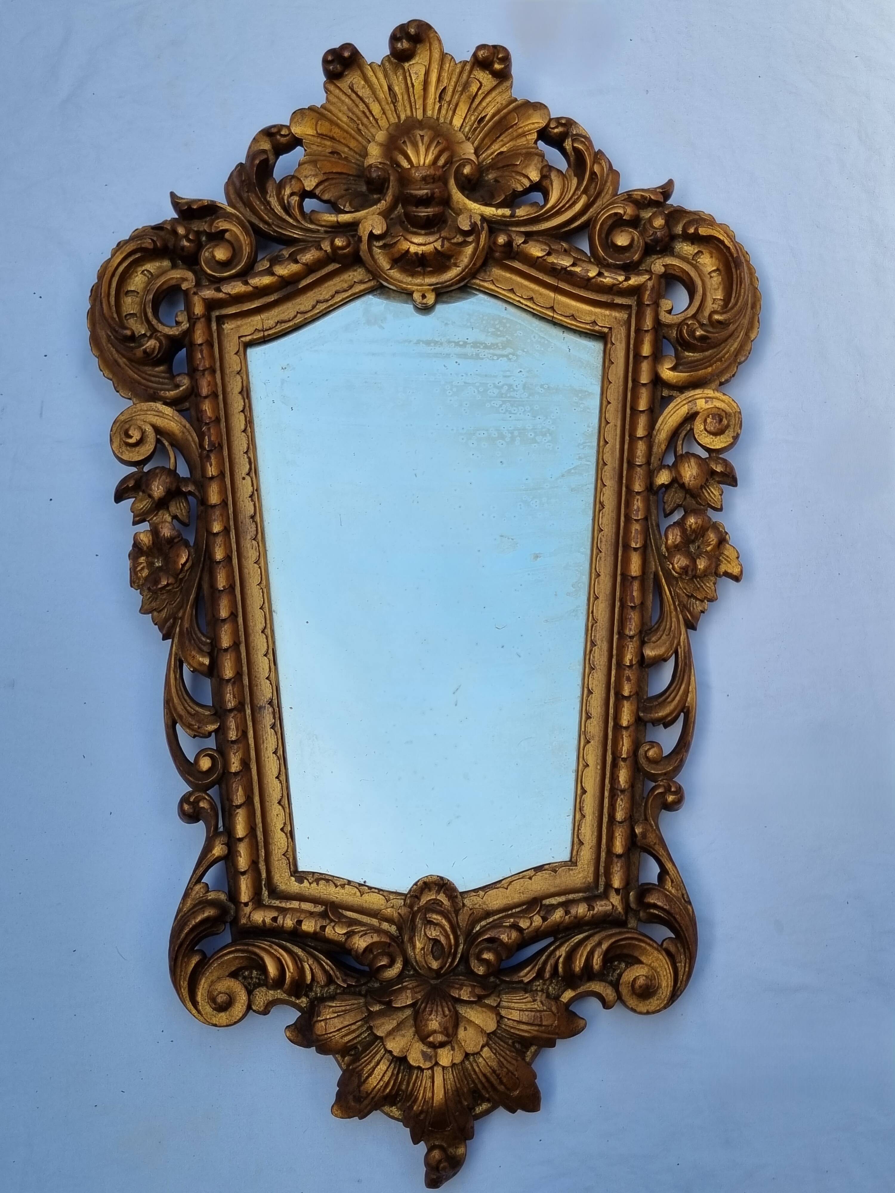 Antique wall mirror in carved gilded wood, Louis XV style, 19th century, 98 x 57 cm.