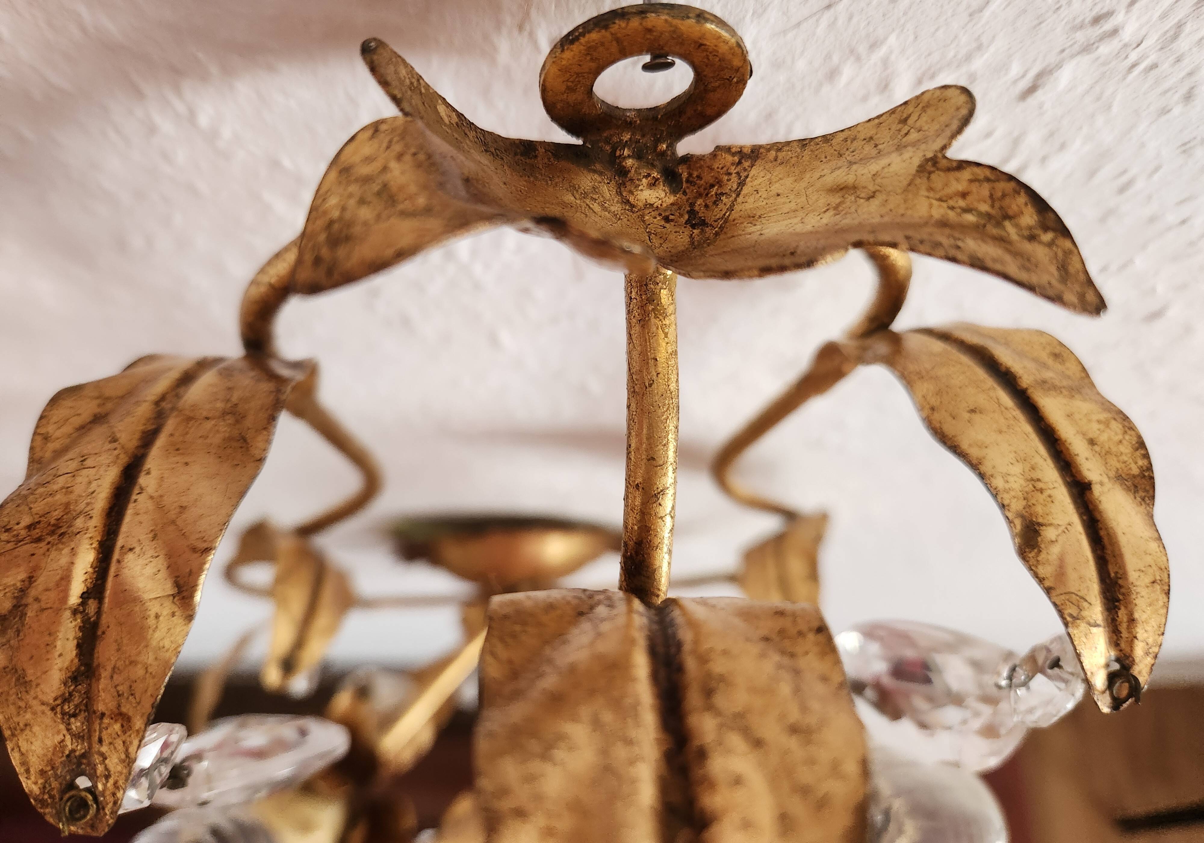 Hand-forged wall lamp gilded with gold leaf and crystals, Italy