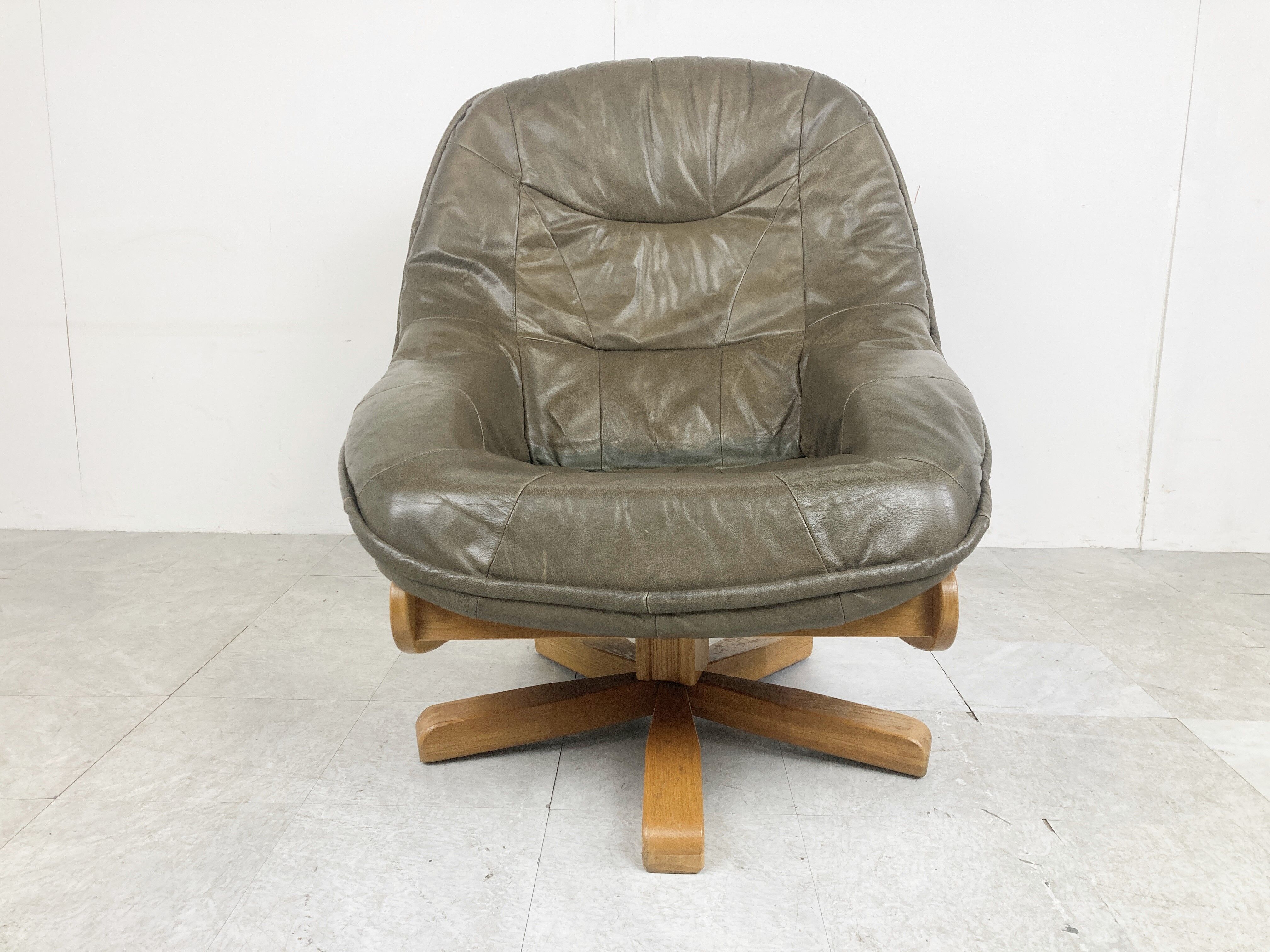 Brutalist oak and leather swivel chair, 1970s