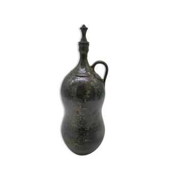 Bottle in iridescent green sandstone from the ceramist jean aimé Poirier