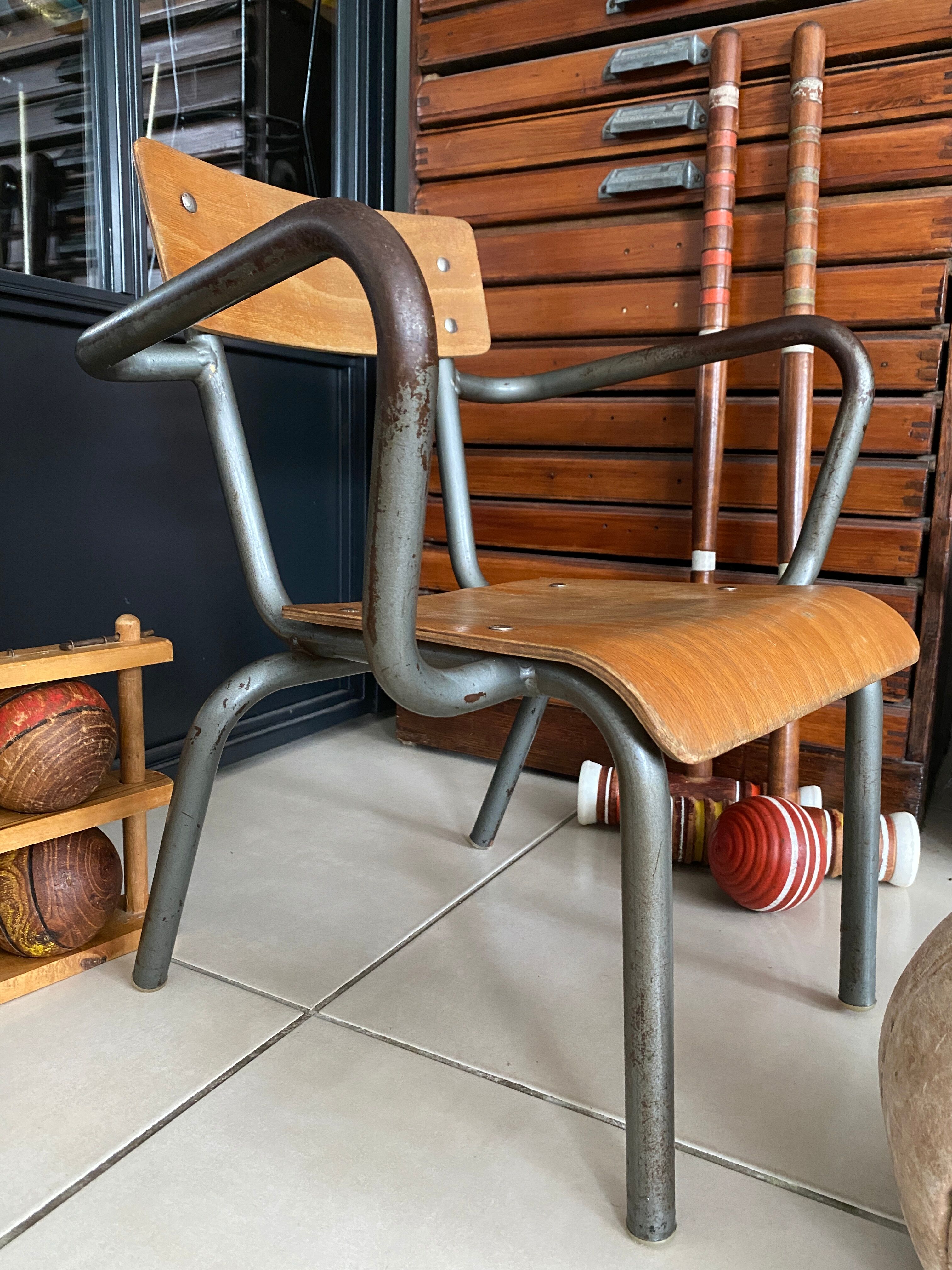 Old Mullca school chair with armrests