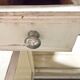 Antique wooden bathroom cabinet with painted finish and white marble.