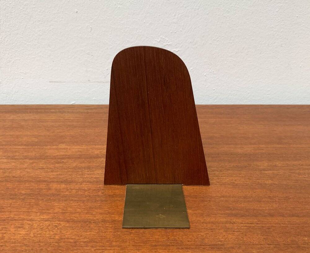 Mid-century Scandinavian bookends in teak and brass.