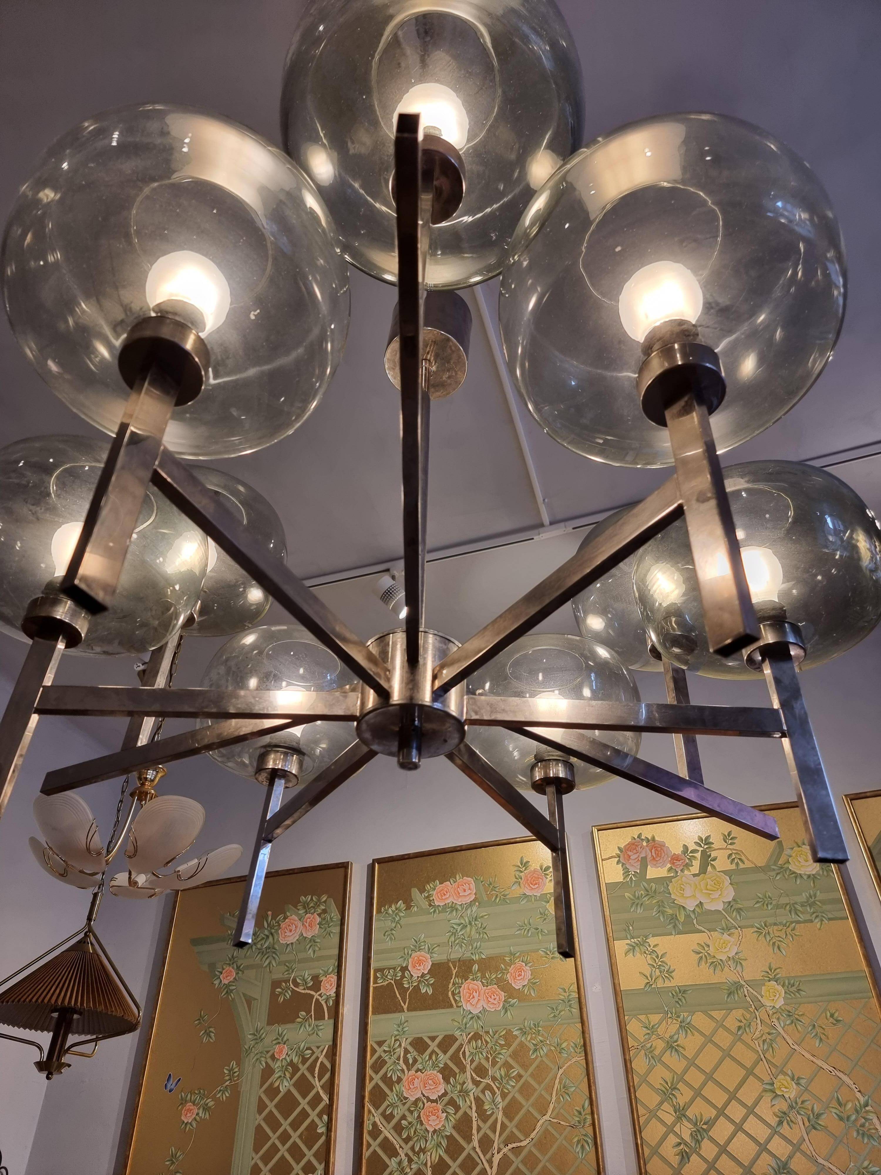 Timeless modern Scandinavian / mid-century chandelier in chrome and smoked glass.