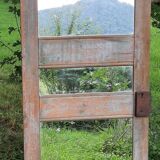Mirror (3 panels) on door.