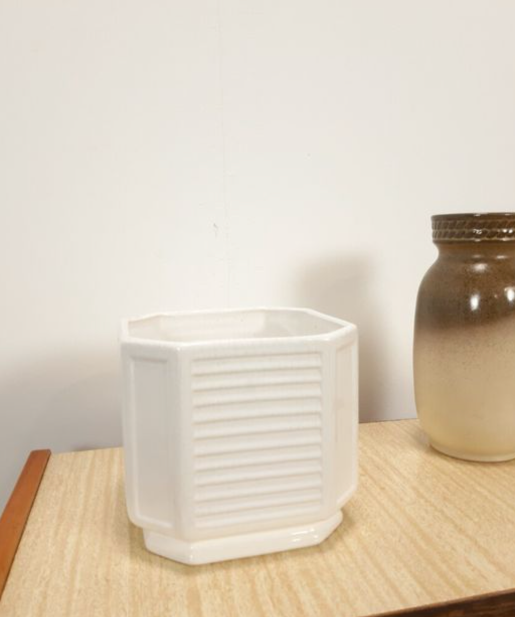 White vintage pot cover with stripes