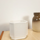 White vintage pot cover with stripes