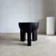 Black mango wood tripod side table with a semi-spherical top, height: 45 cm, diameter: 44 cm.