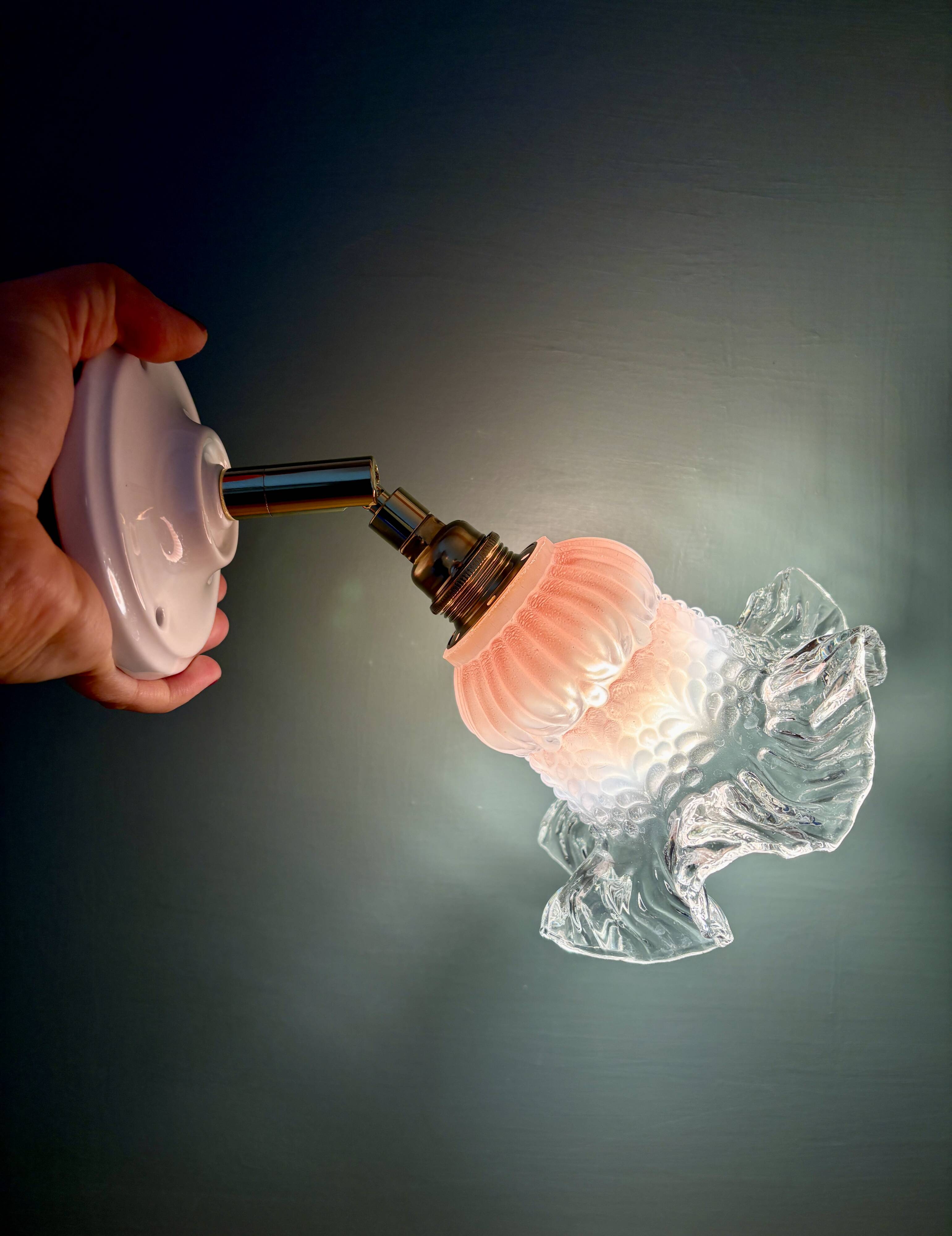 Vintage pink and clear glass tulip wall light.