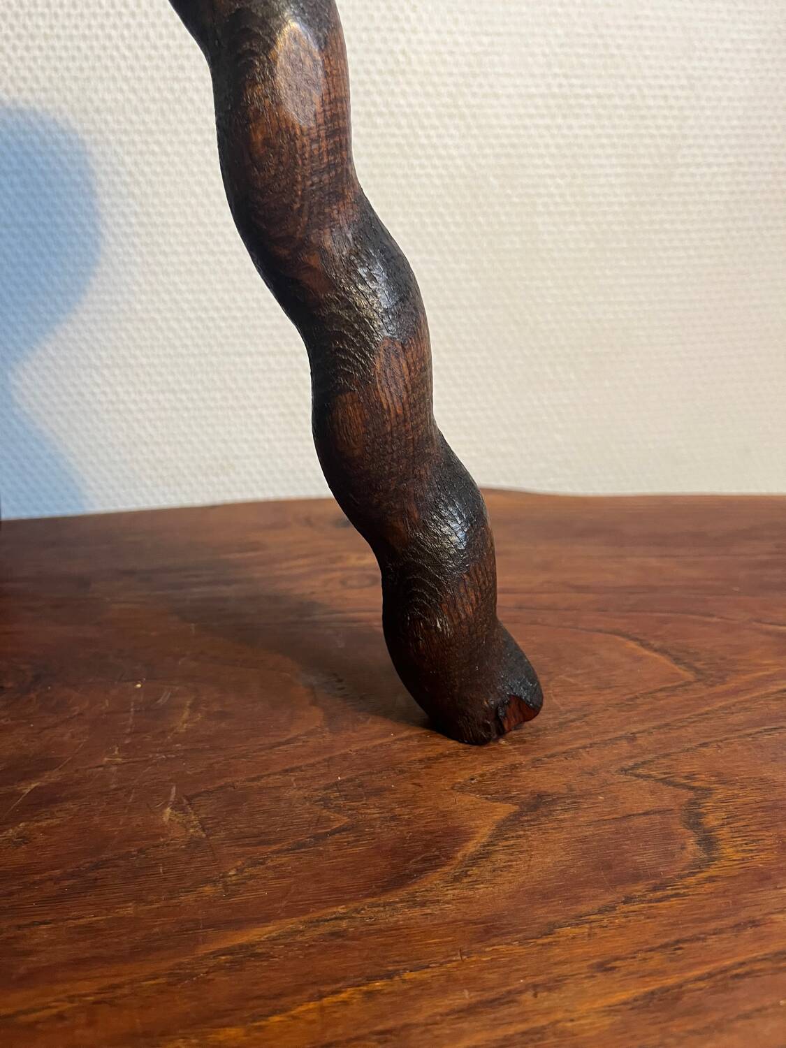 Round wooden tripod stool