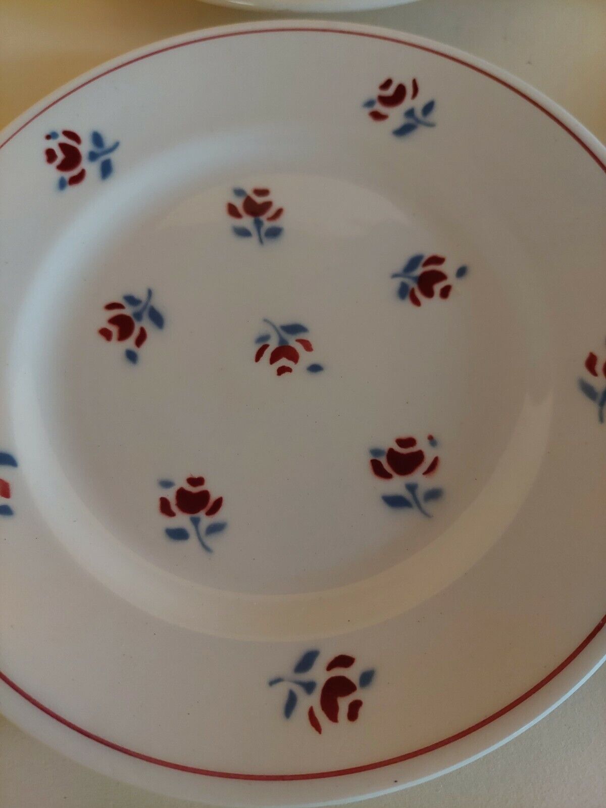 Series of four dessert plates in earthenware Saint Amand décor Rosettes