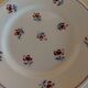 Series of four dessert plates in earthenware Saint Amand décor Rosettes