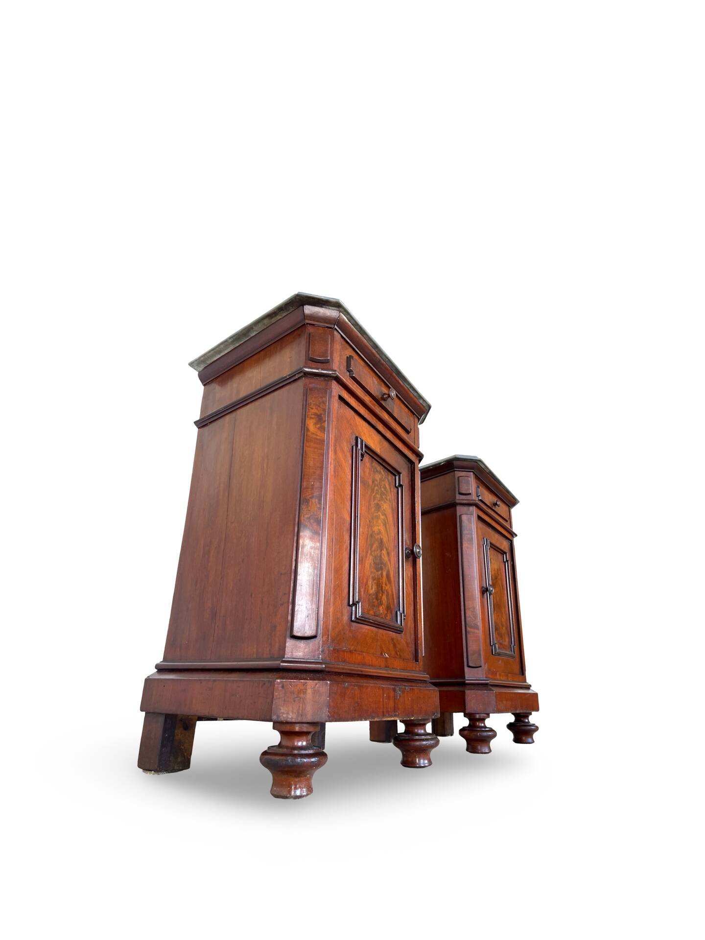 A pair of antique walnut bedside tables from the 1890s.