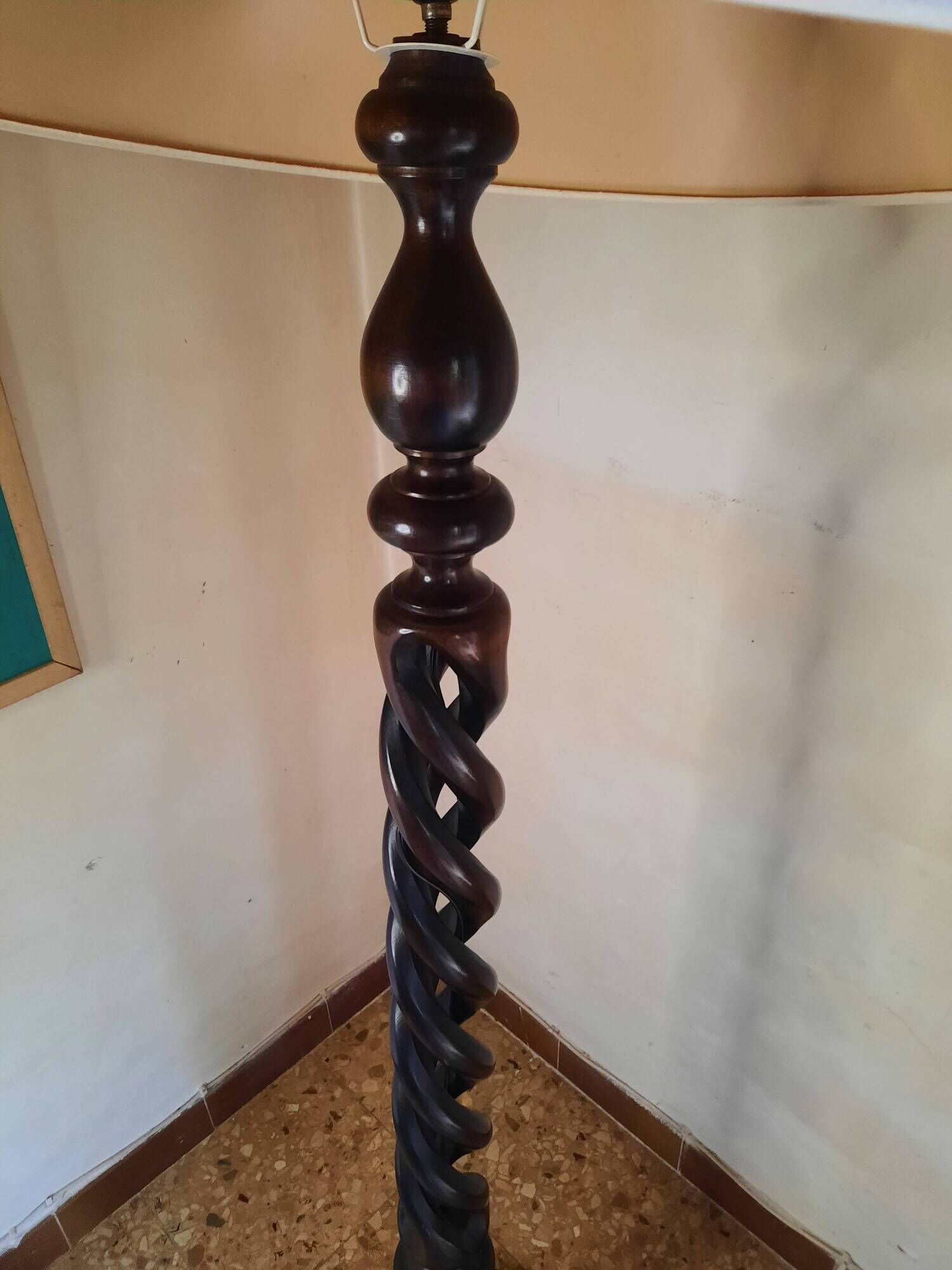 Sculptural floor lamp made of twisted turned wood.