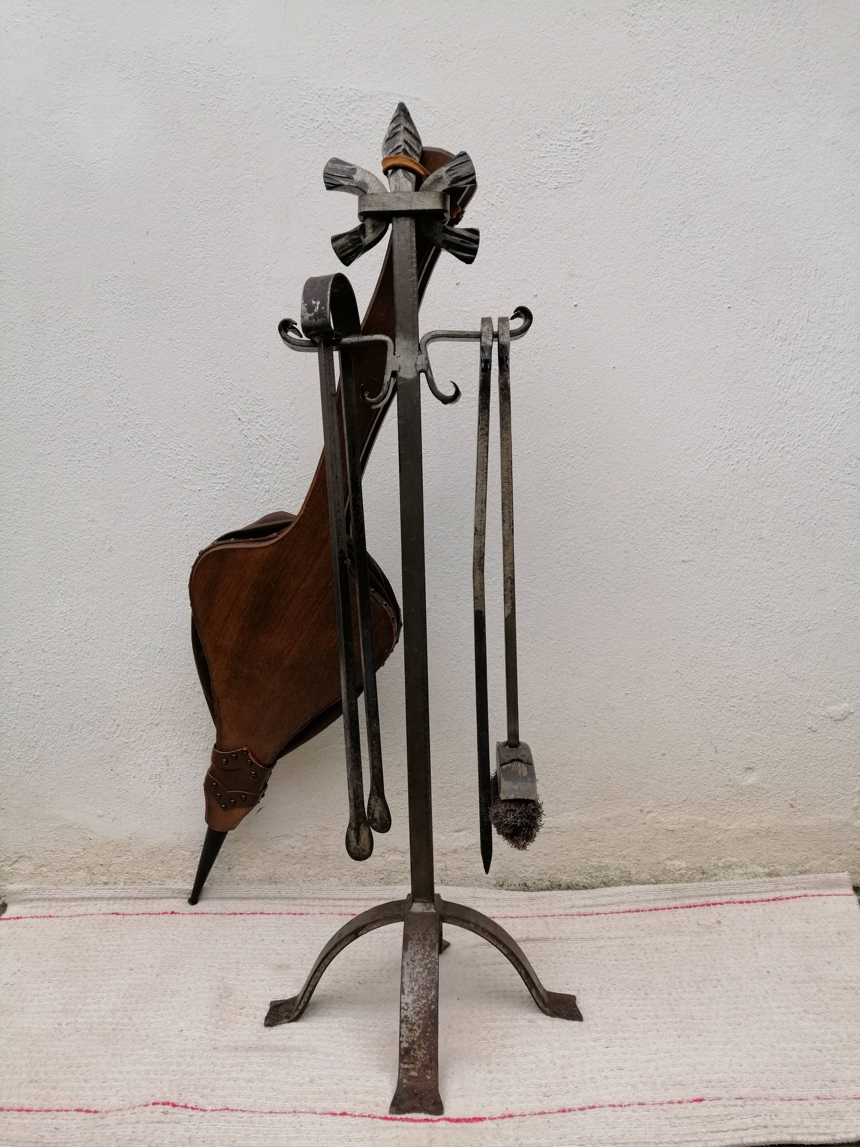 Old wrought iron fireplace servant