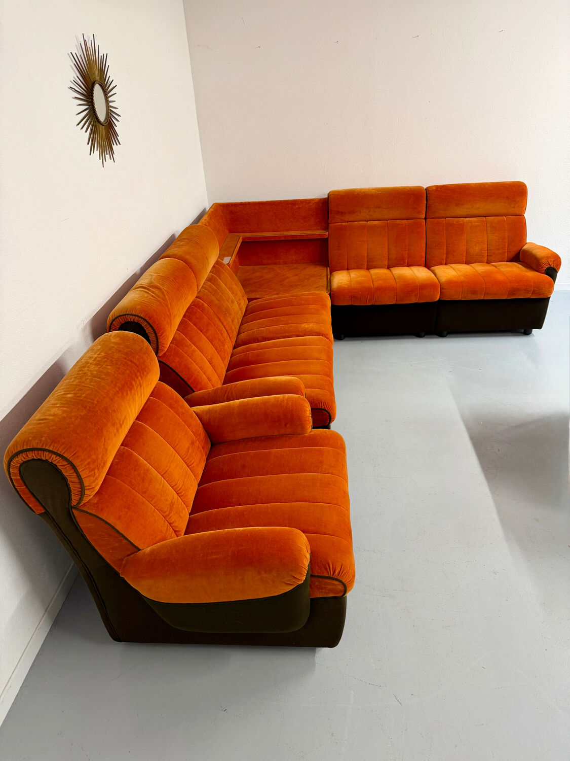 Modular vintage orange corner sofa, 1970s pop design.