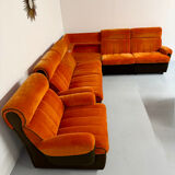 Modular vintage orange corner sofa, 1970s pop design.