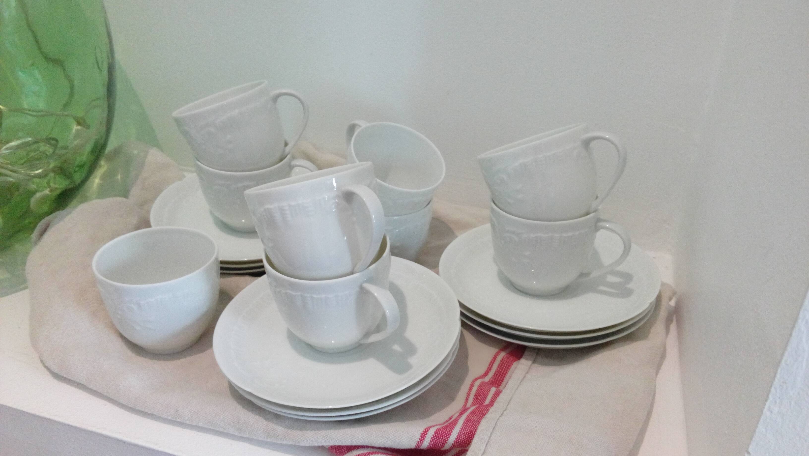 Set of 9 white porcelain coffee cups