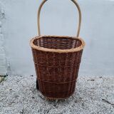Vintage wicker log basket on vintage wheels
