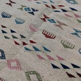 White margoum carpet with multicolored Berber patterns