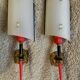 Pair of circa 70s plastic and brass wall lights