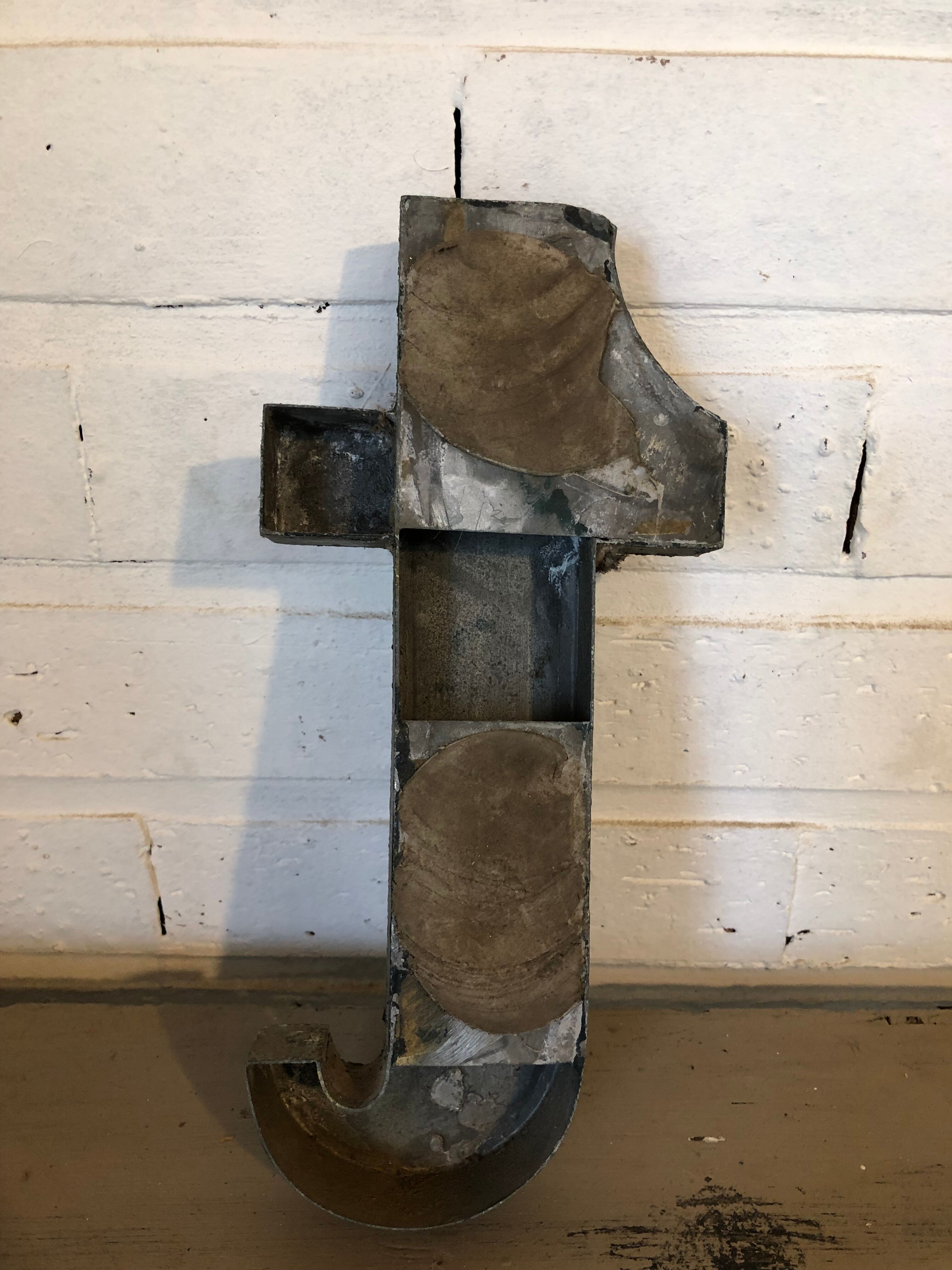 Blue sign letter "T"