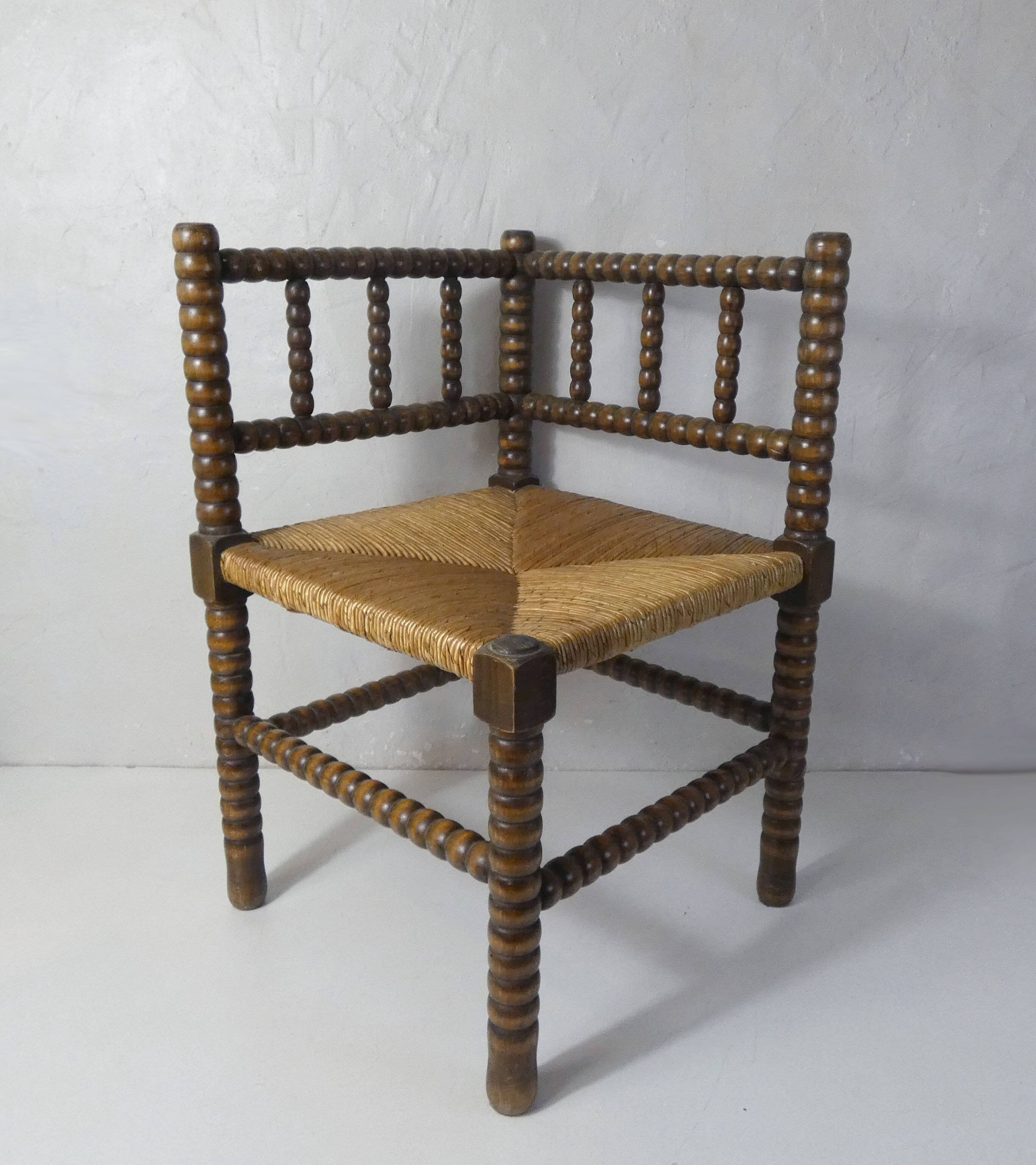 Old corner armchair beaded wood paillé