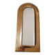 Rounded brass mirror