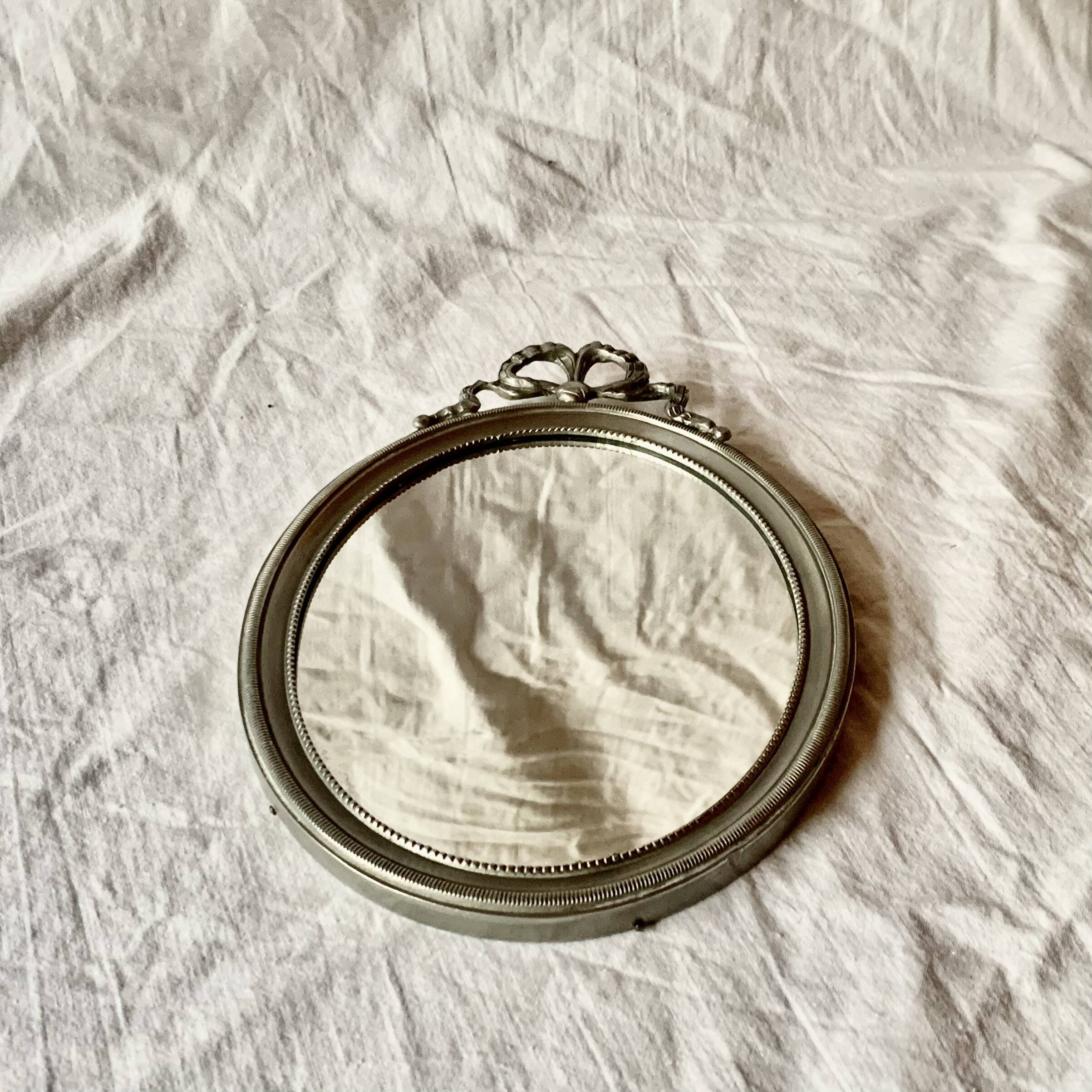 Louis XVI style oval metal wall mirror