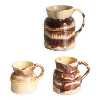 3 old bicoloured enamelled stoneware jugs