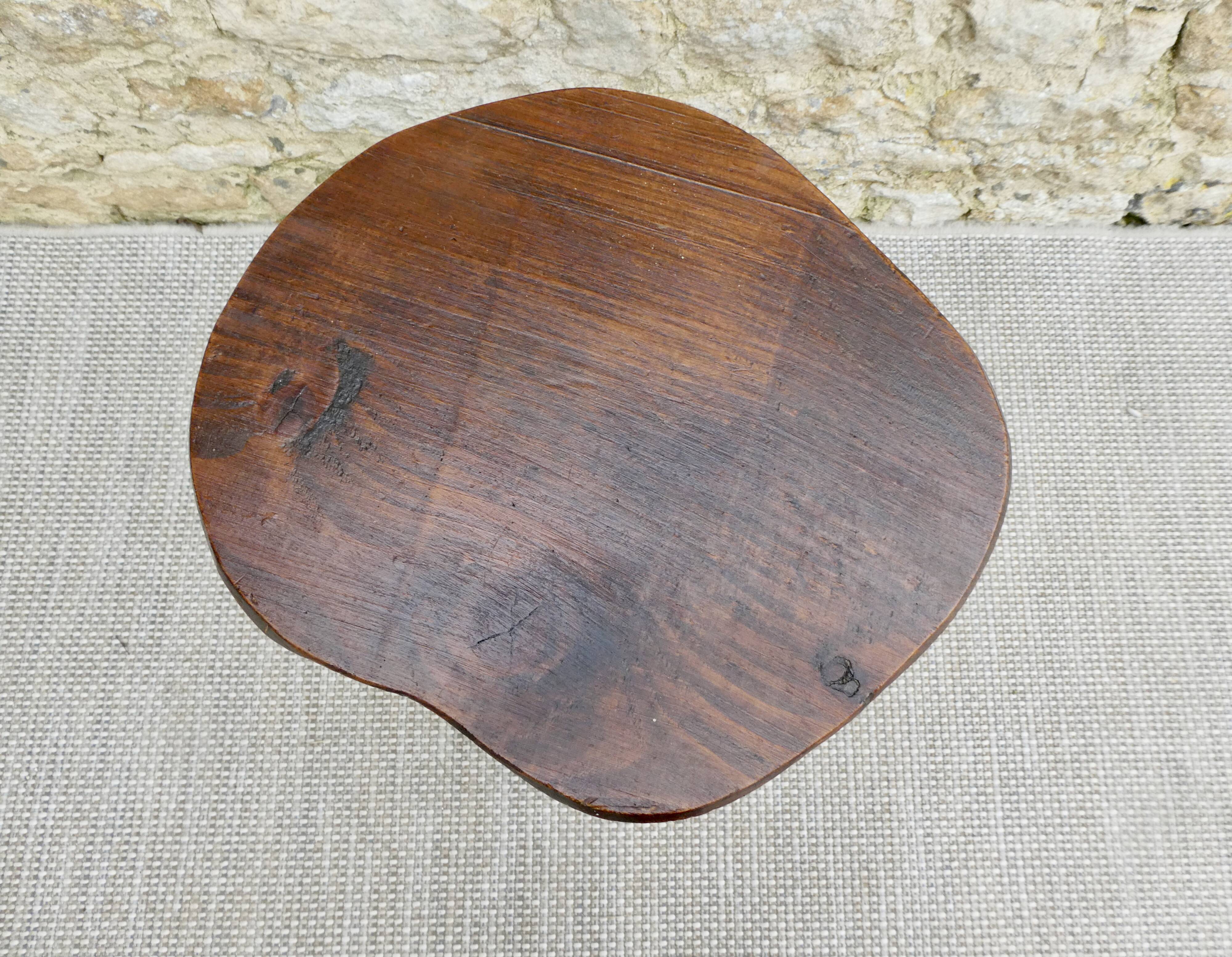 Tripod stool in raw wood