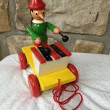 Old toy to pull Pinocchio and his xylophone