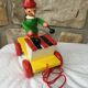 Old toy to pull Pinocchio and his xylophone