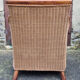 Fauteuil esprit colonial, bois et rotin, accoudoirs