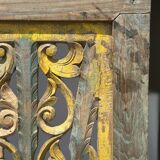 Rectangular Indonesian construction element with blue and yellow plant in carved wood