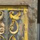 Rectangular Indonesian construction element with blue and yellow plant in carved wood