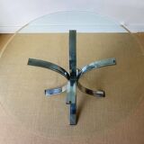 Round glass dining table, circa 1970.