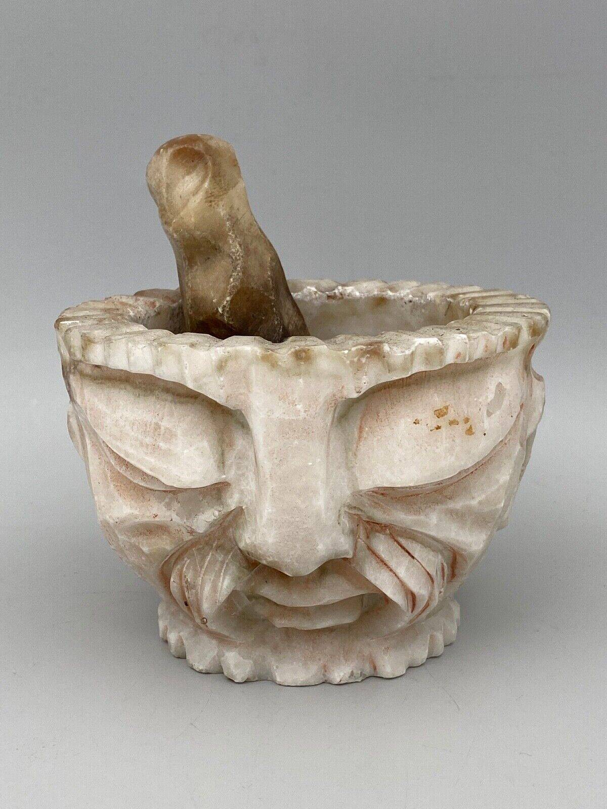 Pharmacy mortar and pestle in alabaster China man's face