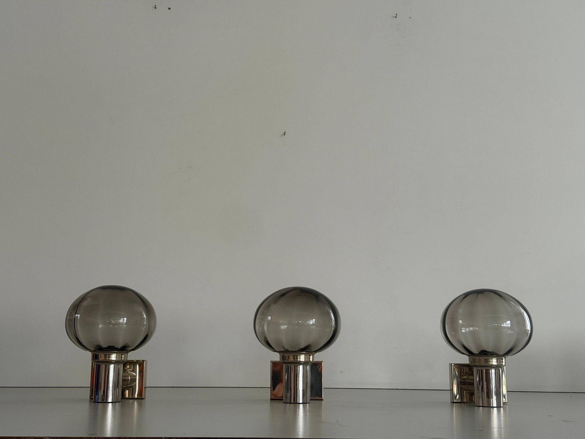 Set of 3 grey glass and chrome wall lights from the mid-century by N Leuchten, 1960s, Germany.