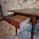 Antique English drop-leaf table in mahogany, late 19th century.