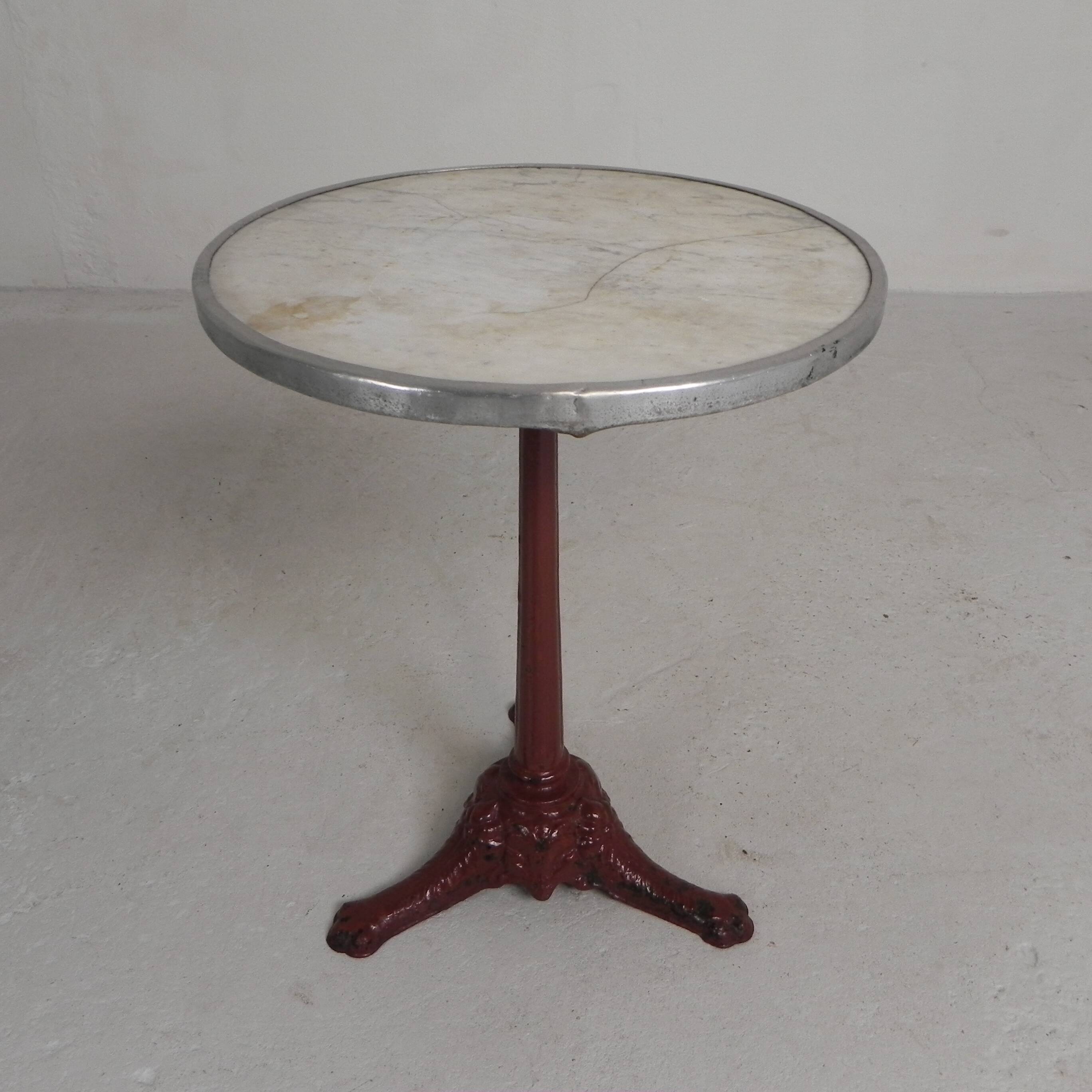 Bistro table with cast iron legs and marble top, 1920s.