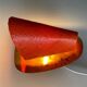 Pair of orange plexiglass and curved brass wall lights, 1950s, Germany