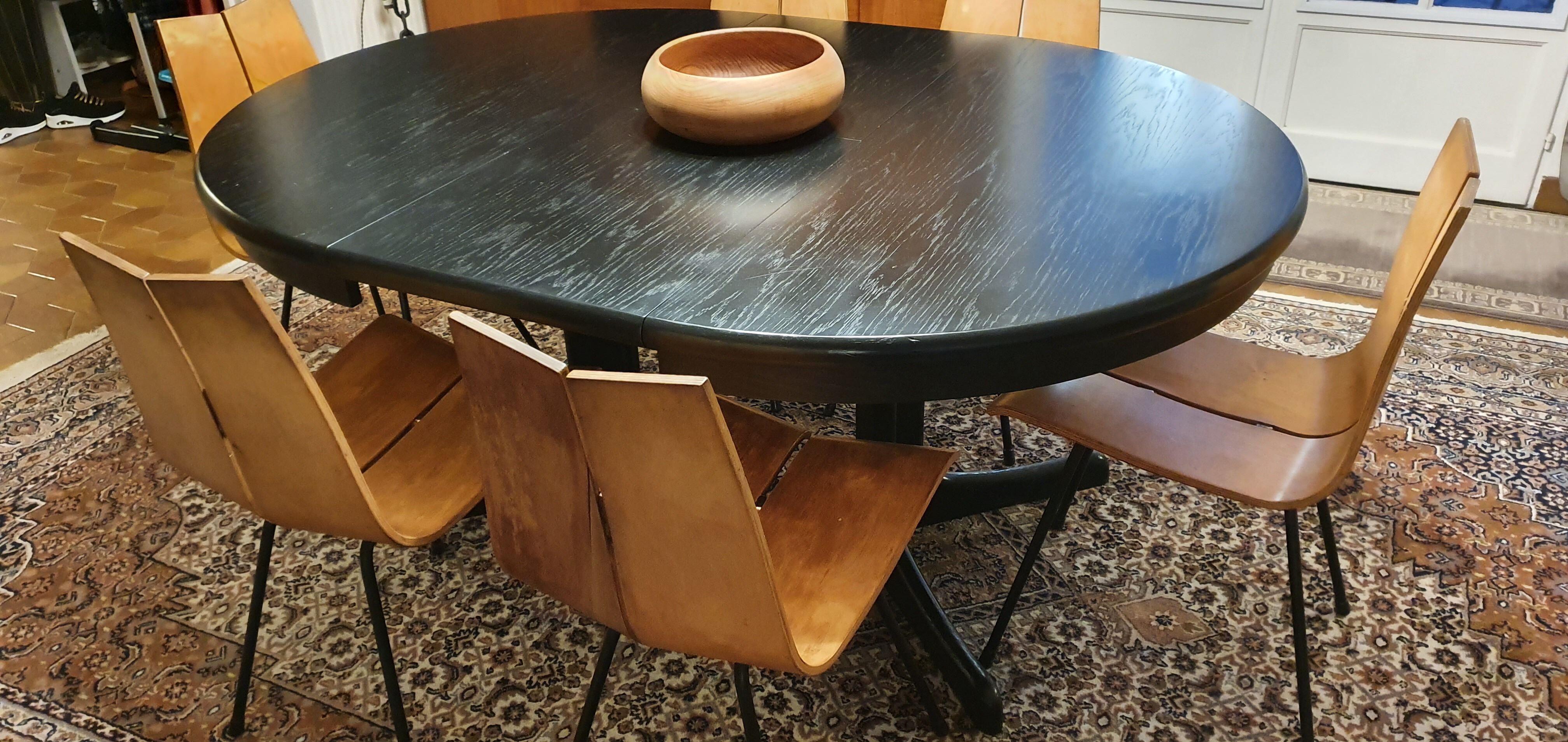 Baumann-type table with 4/8-person extensions.