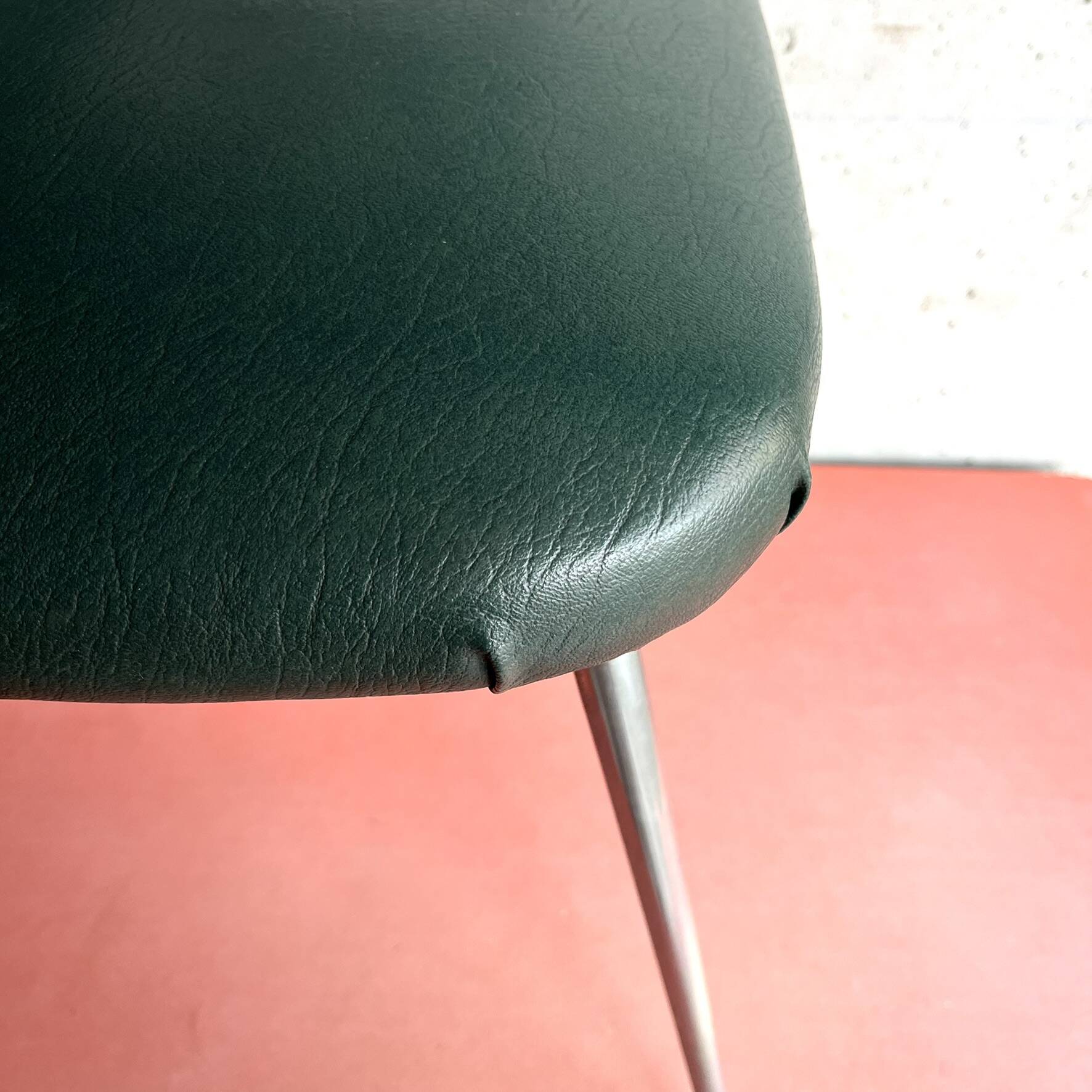 Vintage green faux leather and chrome armchair