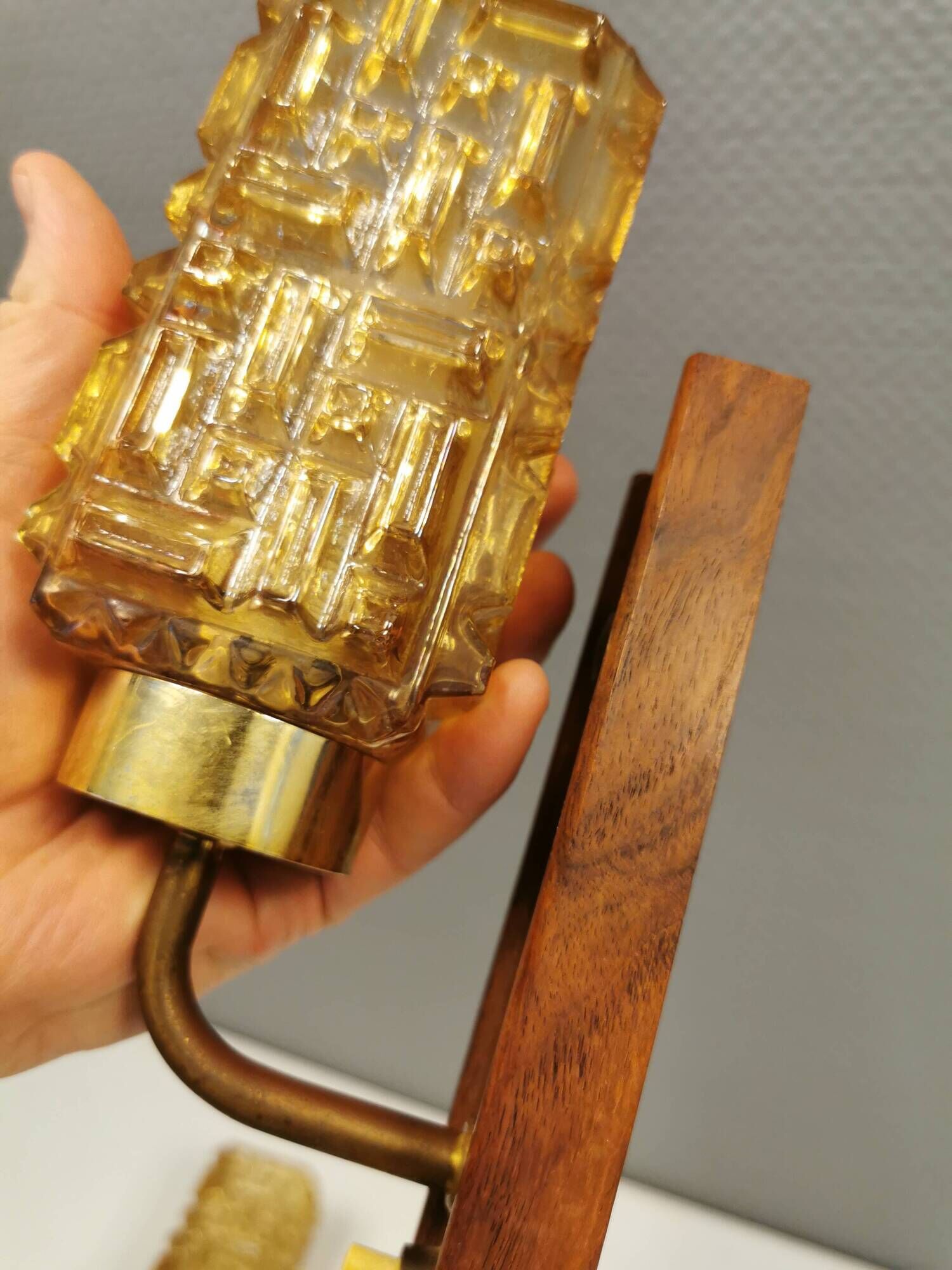 wall lights in rosewood look, with amber coloured glass and brass details.