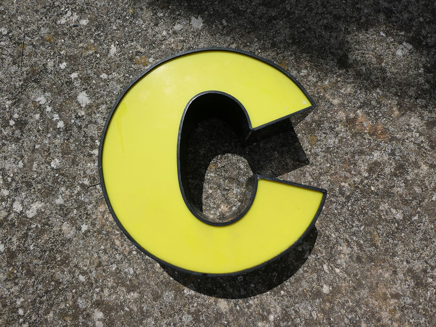 Letter C of yellow and black industrial sign