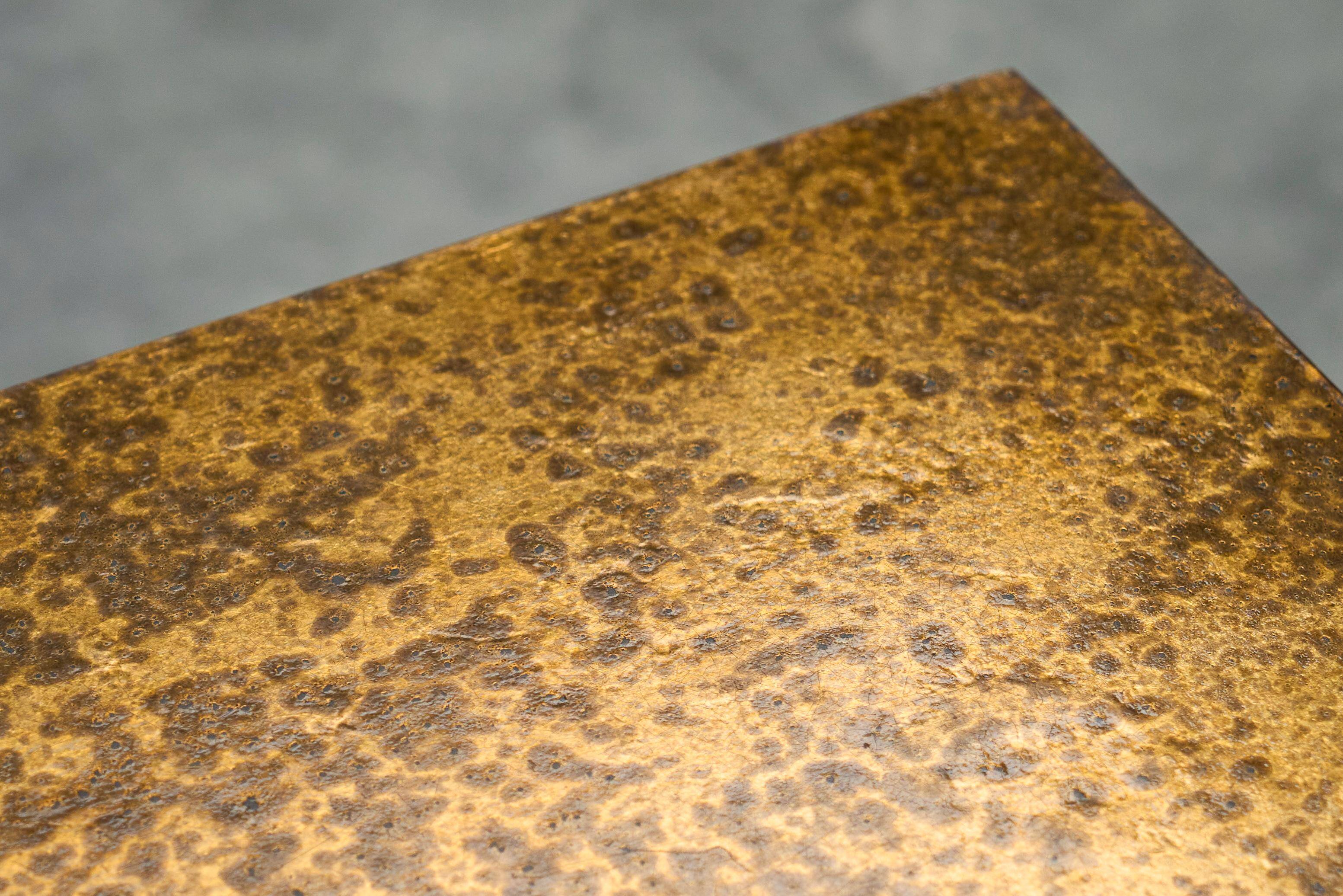 Modernist coffee table with a patinated gold top, 120x52.5x36 cm, mid-20th century.